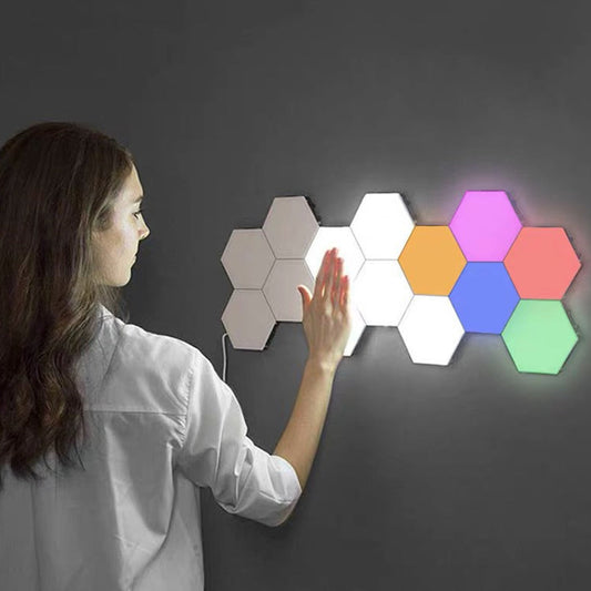 Wall Mounted LED Hexagonal Lamps Creative on a wall, illuminating in various colors.