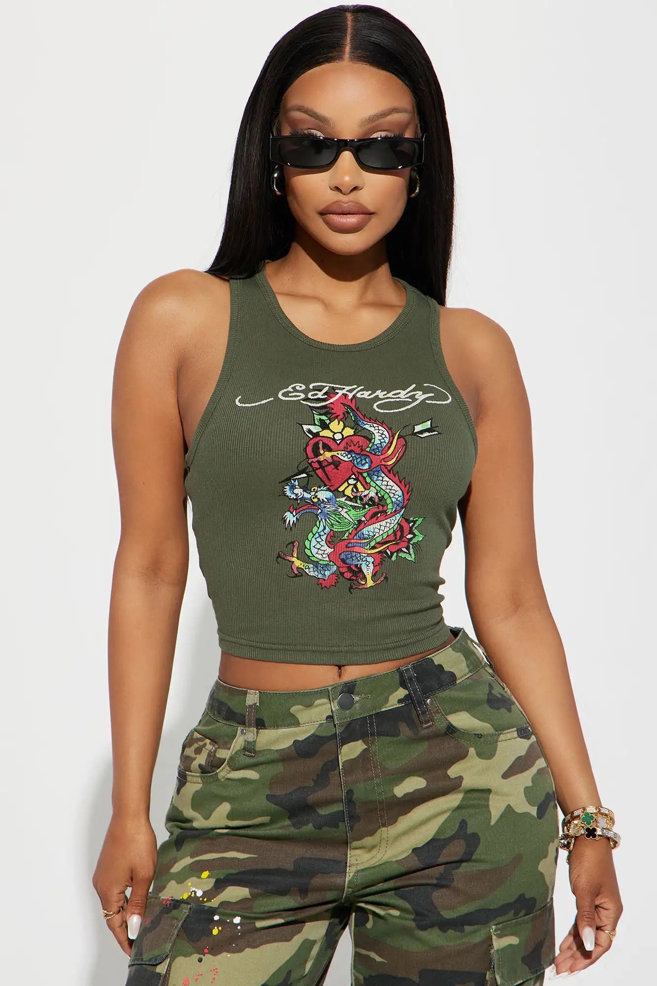 Women's green sleeveless round neck tank top with gothic graffiti print.