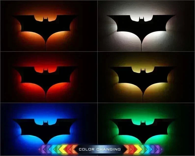 Batman-themed night light with remote control, displaying multiple colors in a 3D creative bat shape for home decoration.