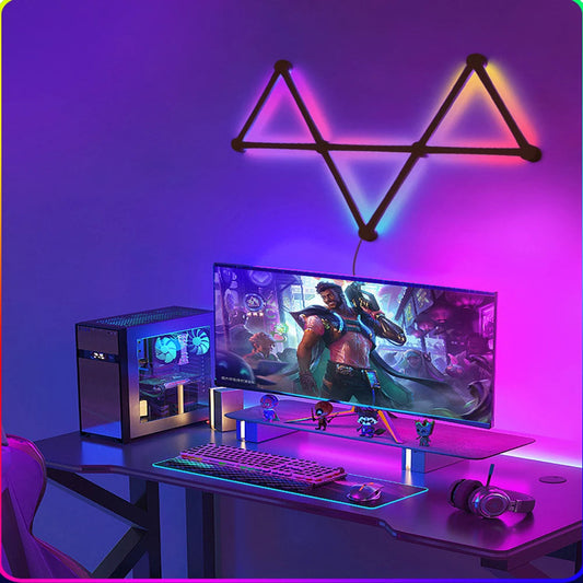 WIFI LED Smart Wall Lamp RGBIC Light Bar in a geometric design above a gaming desk setup.