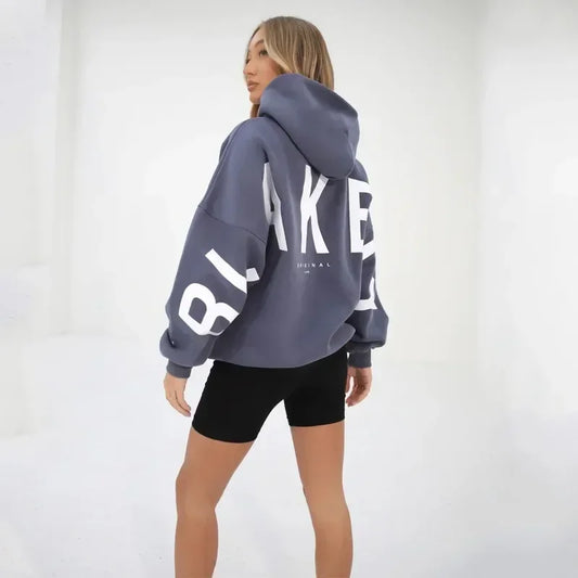 Women's hooded soft sweater pullover with letter print, casual streetwear style.